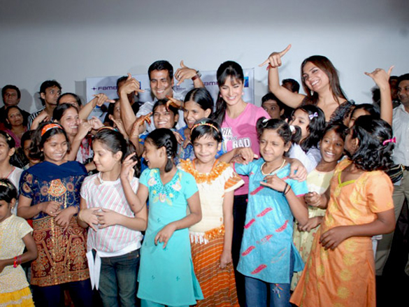 akshaylara and katrina watch blue with ngo kids 9