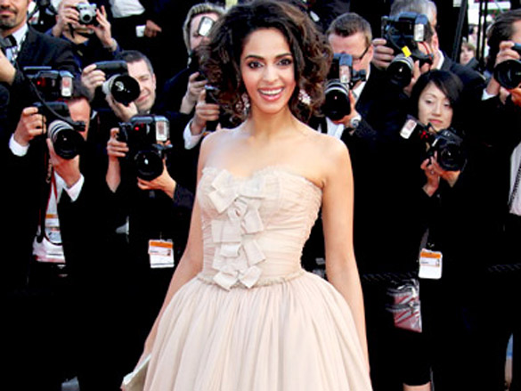 mallika sherawat attends the premiere of wall street money never sleeps held at the palais des festivals during the 63rd annual international cannes film festival 2