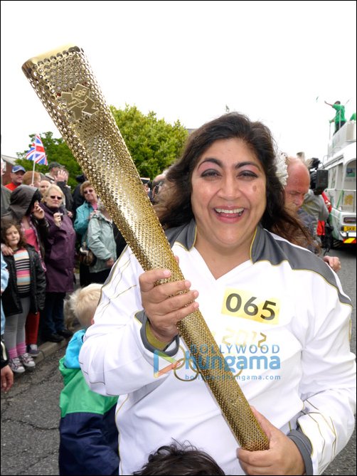 Gurinder Chadha runs with Olympic Torch