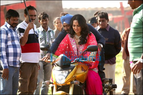 Ajay teaches Sonakshi how to ride bike