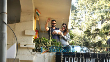 Saif Ali Khan and Kareena Kapoor Khan pose with baby Taimur outside their residence