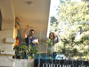 Saif Ali Khan and Kareena Kapoor Khan pose with baby Taimur outside their residence