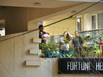 Saif Ali Khan and Kareena Kapoor Khan pose with baby Taimur outside their residence