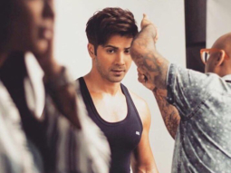 Check out: Varun Dhawan shows off his buffy arms during an ad shoot