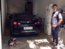 Must See: John Abraham poses for a picture with his Godzilla