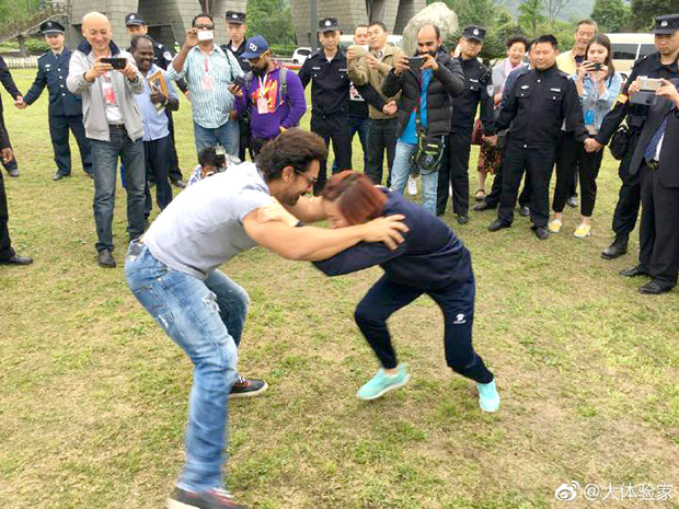 Watch Aamir Khan wrestles with several women during his China visit2