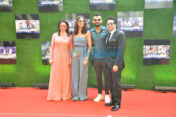 anushka sharma and cricketer virat kohli pose with sachin tendulkar at the premiere of sachin a billion dreams 2