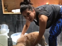 CUTE! Sunny Leone bathes her pet dog Bella
