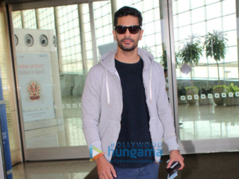 Hema Malini and Angad Bedi snapped at the airport