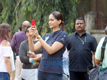 Sonam Kapoor and Kapil Dev at an event held by Magic Bus in Dharavi
