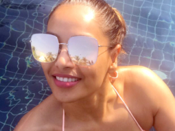 Bipasha Basu loves to flaunt her pink bikini and also her monkey love for hubby Karan Singh Grover