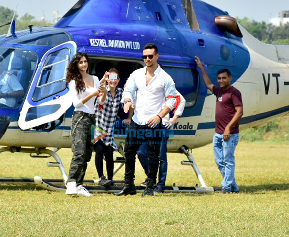 tiger shroff and disha patani arrive in a helicopter for the trailer launch of baaghi 2 8