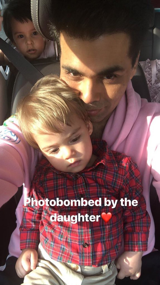 This image of Roohi photo bombing Karan Johar and Yash is simply the cutest