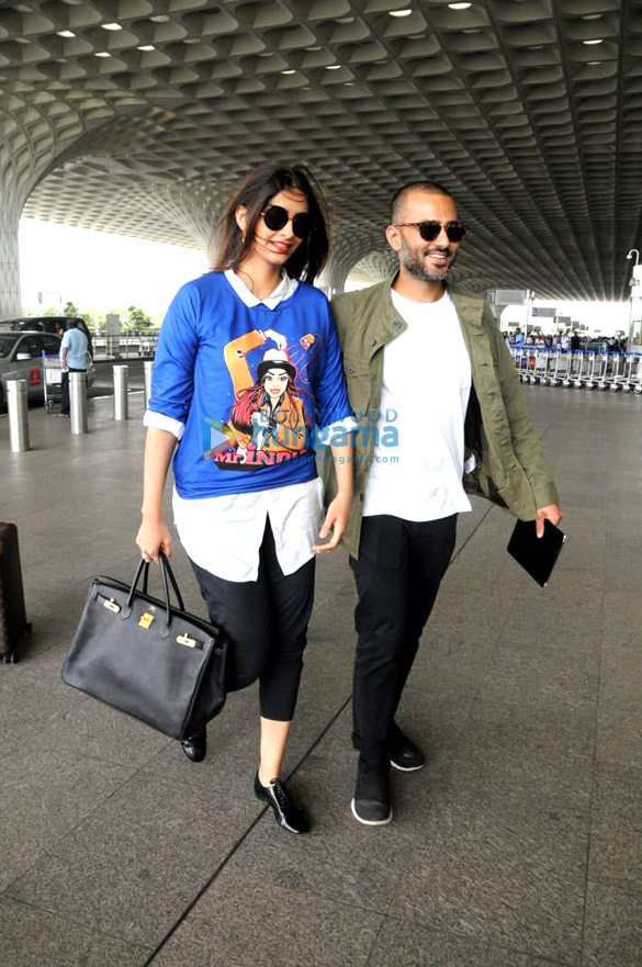 karan johar and evelyn sharma snapped at the airport 12