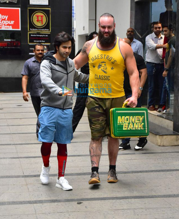 Varun Dhawan flexes his muscles with WWE Superstar Braun Strowman