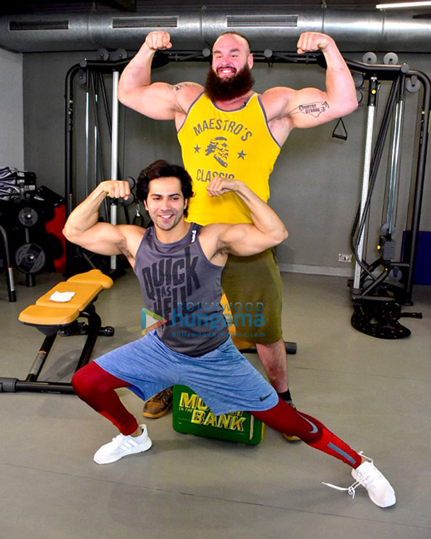 Varun Dhawan flexes his muscles with WWE Superstar Braun Strowman