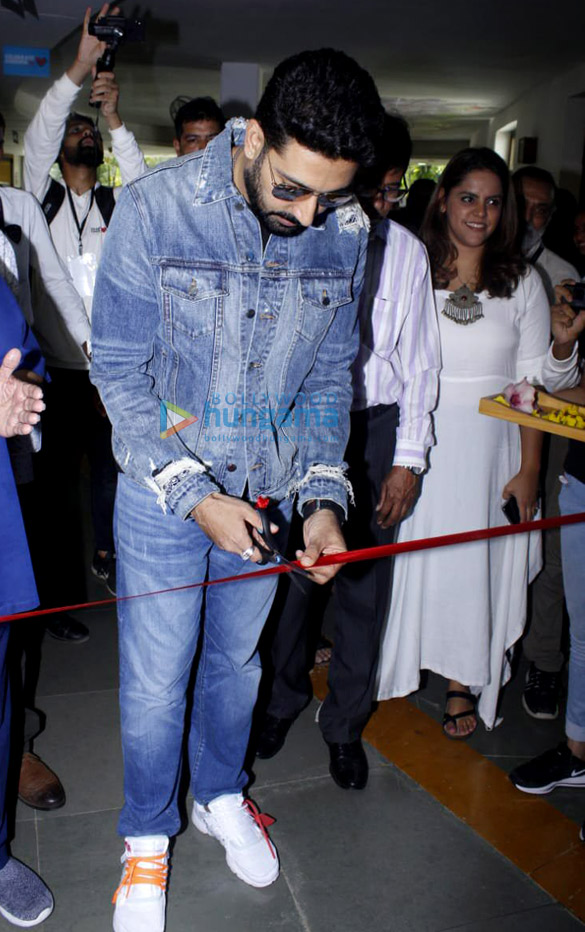 abhishek bachchan graces the inauguration of the whistling woods international 75 frames rare portrait collection of amitabh bachchan 1