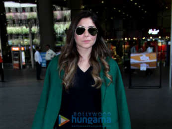 Kanika Kapoor and R Madhavan snapped at the airport