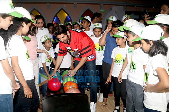 kartik aaryan snapped spending childrens day with kids from smile foundation at smash 3