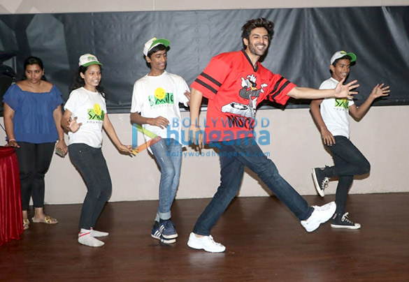 kartik aaryan snapped spending childrens day with kids from smile foundation at smash 4