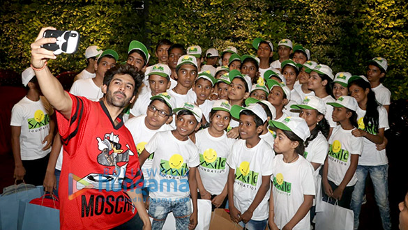 kartik aaryan snapped spending childrens day with kids from smile foundation at smash 5