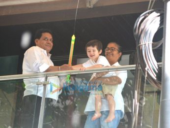 Taimur Ali Khan spotted playing Holi in his balcony