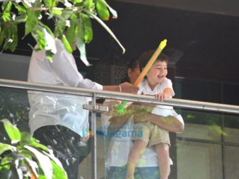 Taimur Ali Khan spotted playing Holi in his balcony