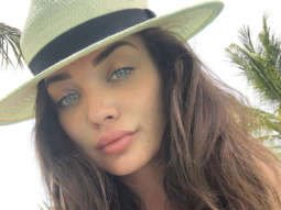 Amy Jackson flaunts her baby bump while enjoying miniature golf