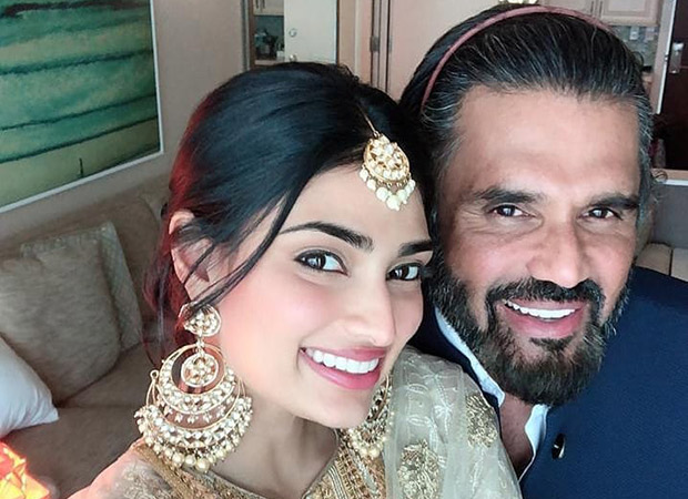 Athiya Shetty and Suneil Shetty are all smiles as they pose for a selfie at a wedding