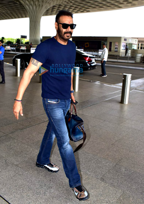 sonam kapoor ahuja anand ahuja and karan johar snapped at the airport 2 2
