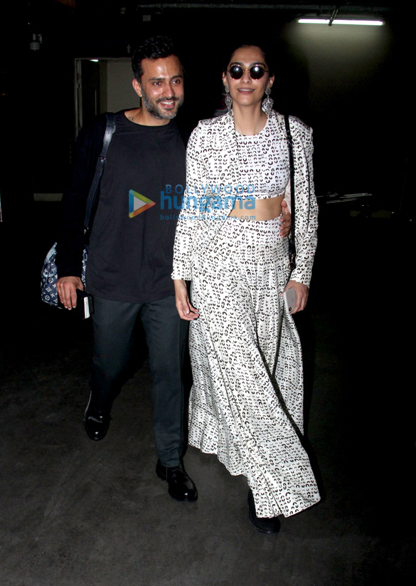 sonam kapoor ahuja anand ahuja and karan johar snapped at the airport 3