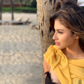 SUMMER SIZZLE Mouni Roy dips her toes in sand wearing a sexy bralette, reminisces about the latest GOT episode