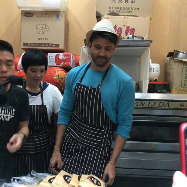 WATCH: Hrithik Roshan makes wheat noodles, serves food to fans at a local restaurant in China