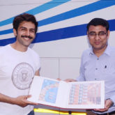 Kartik Aaryan is all smiles as he receives a customised stamp collection from Lucknow GPO!