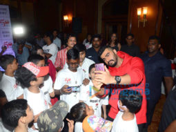 Photos: Arjun Kapoor celebrates ‘National Cancer Rose Day’ with cancer affected children