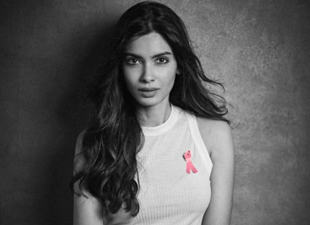 Estée Lauder's global brand ambassador, Diana Penty, dons a pink ribbon for breast cancer awareness