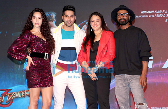 photos varun dhawan nora fatehi and remo dsouza grace the song launch of garmi from their film street dancer 3d 3