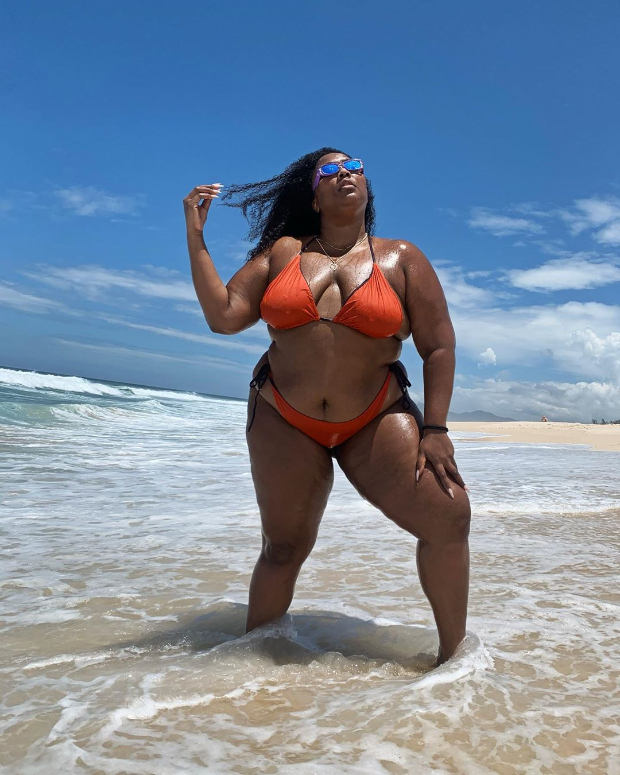 Lizzo enjoys beach vacation in red bikini during her trip to Brazil