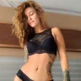 Elli AvrRam turns up the heat in a black bikini! See photos