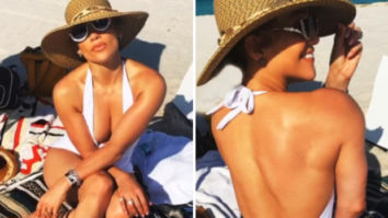 Jennifer Lopez soaks under the Miami sun flaunting her toned body in white halter-neck swimsuit