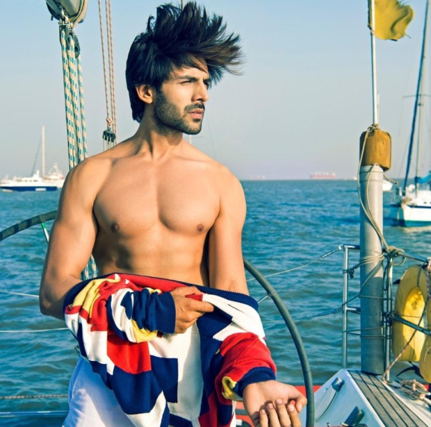 Kartik Aaryan strikes a pose shirtless on a boat, says 'You can lockdown a man, not his hair’