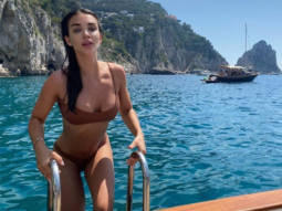 Amy Jackson stuns in brown two piece bikini whilst swimming in Capri