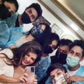 Jacqueline Fernandez poses with her team as she resumes work
