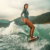 Lisa Haydon sizzles in printed swimsuit as she goes surfing in Hong Kong