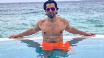 Varun Dhawan is chilling in the pool in Maldives flaunting his ab-tastic physique