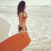Kim Sharma shares bikini photo remembering her beach days; gets trolled by Yuvraj Singh 