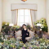 BTS drops second interactive concept photos that feature member Jimin surrounded by a room full of flowers