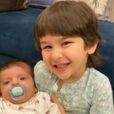 Taimur Ali Khan poses with a baby and he cannot stop smiling