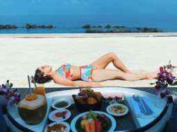 Sara Ali Khan soaks in the sun in a printed bikini during her Maldives vacation; shares a shayari along with pictures