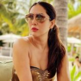Check out! Kim Sharma looks drop-dead gorgeous in a golden monokini